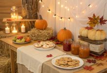 Cozy November baby shower setup with rustic fall decor, warm lighting, and seasonal treats