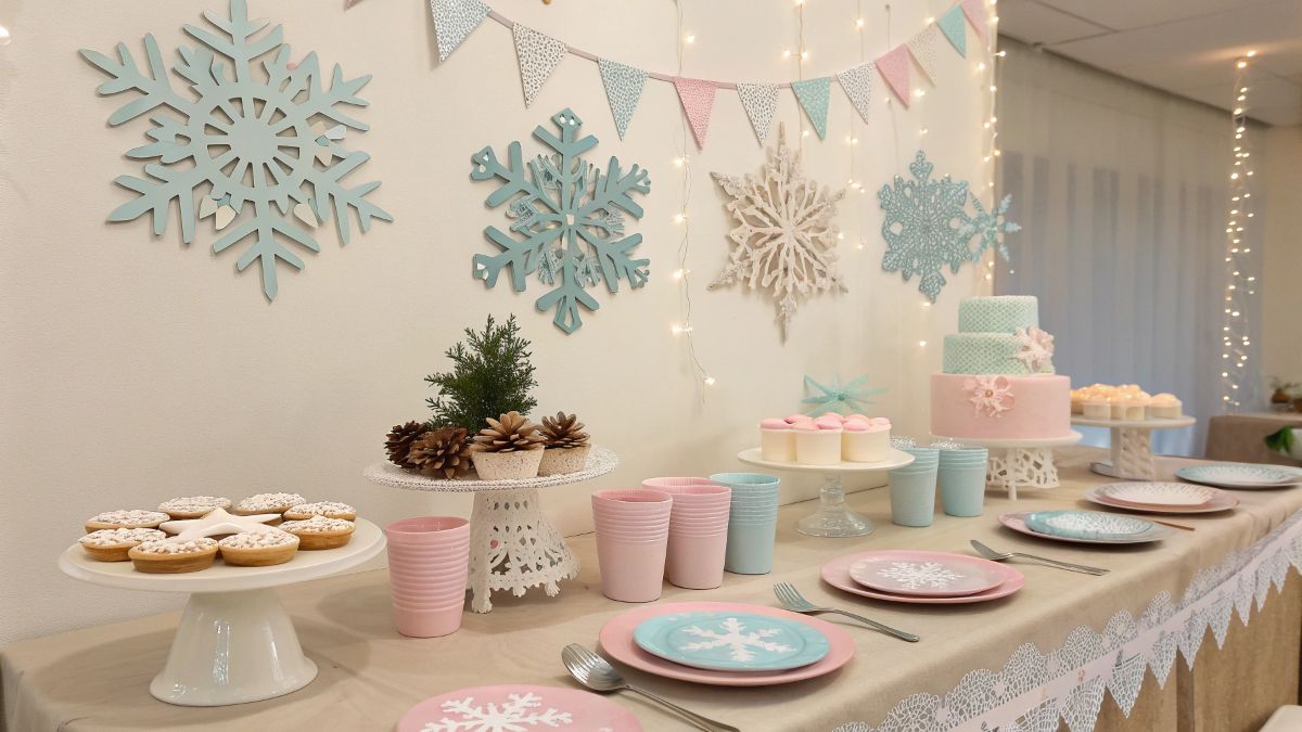 Cozy winter-themed baby shower setup with snowflake decorations and pastel table settings – January baby shower ideas