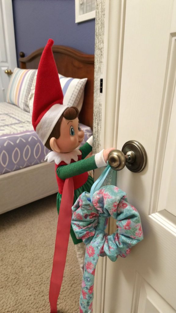 30 Elf on the Shelf Ideas for Toddlers: Easy, Fun & Magical Ways to Delight Little Ones This Christmas (2025 Edition) 5 Elf Hanging from a Doorknob