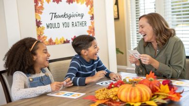Family laughing while playing Thanksgiving Would You Rather game with printable cards