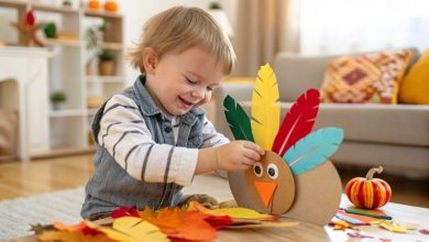 27 Thanksgiving Crafts for Toddlers: Easy, Adorable, and Educational Ideas Your Little Ones Will Love (2025 Guide) 6 Smiling toddler making a paper turkey craft with colorful feathers for Thanksgiving