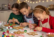 Children making gingerbread man crafts with colorful Christmas decorations