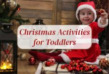 Smiling toddler doing Christmas craft project with colorful ornaments and lights