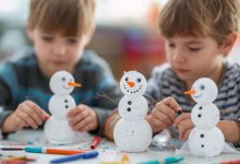 Snowman crafts for kids made with construction paper and simple DIY supplies